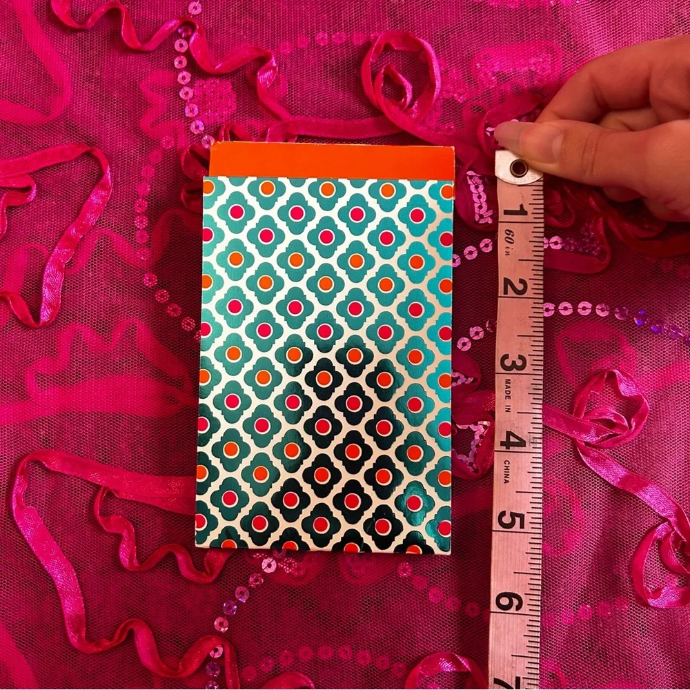 turquoise and orange unlined notepad